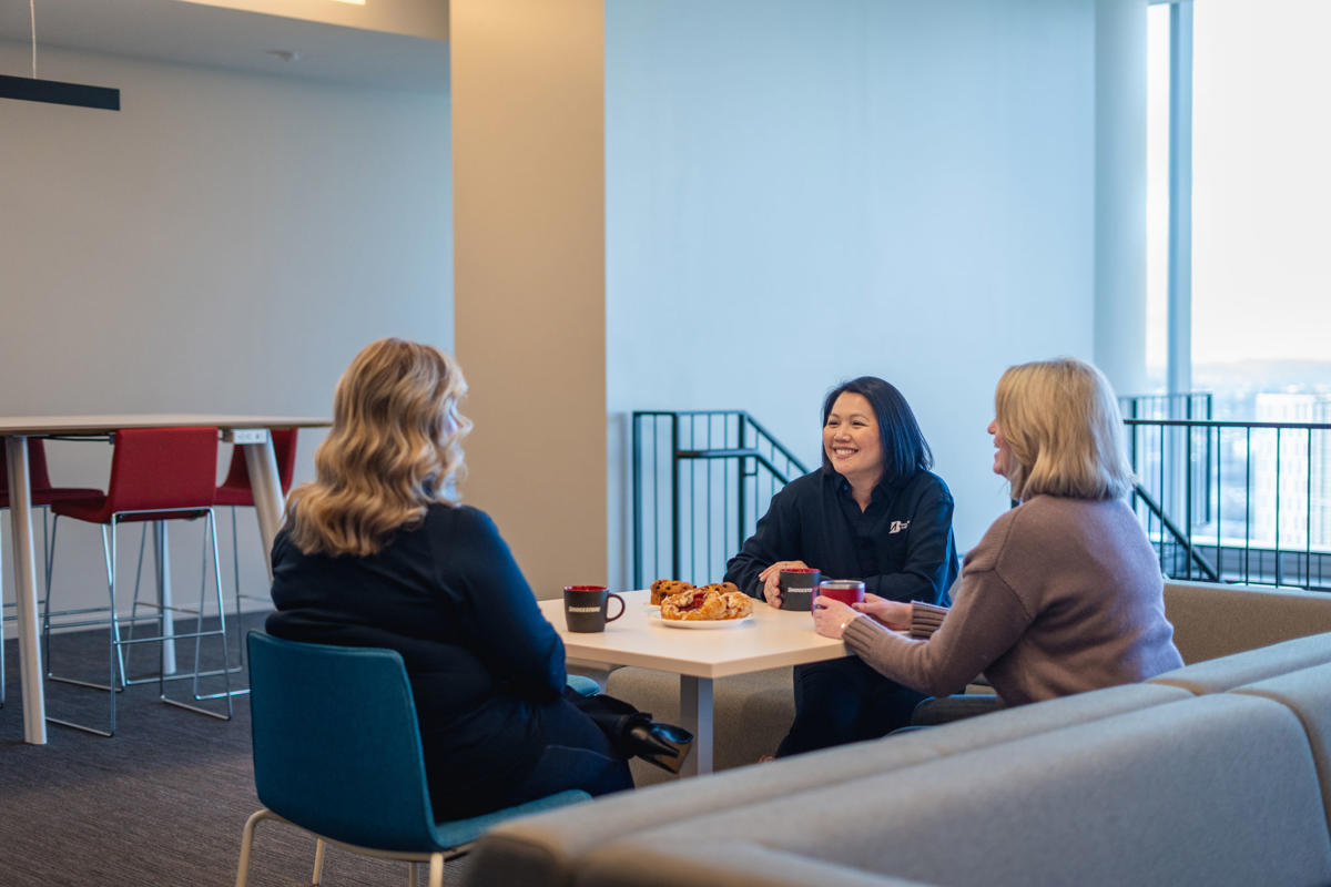 a group of women sitting around a table