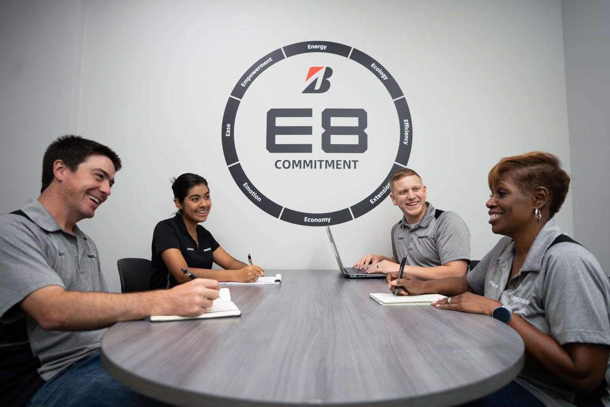 a group of people sitting at a table